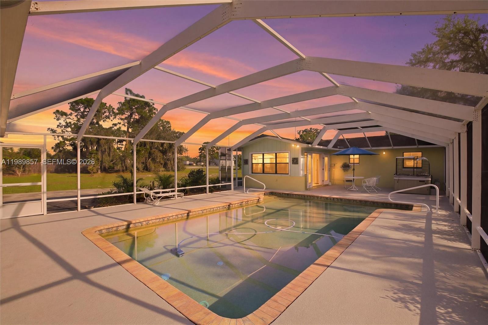 49 Williams Road Lake Placid, FL 33852 - Photo 42 of 61 a view of a backyard with a swimming pool