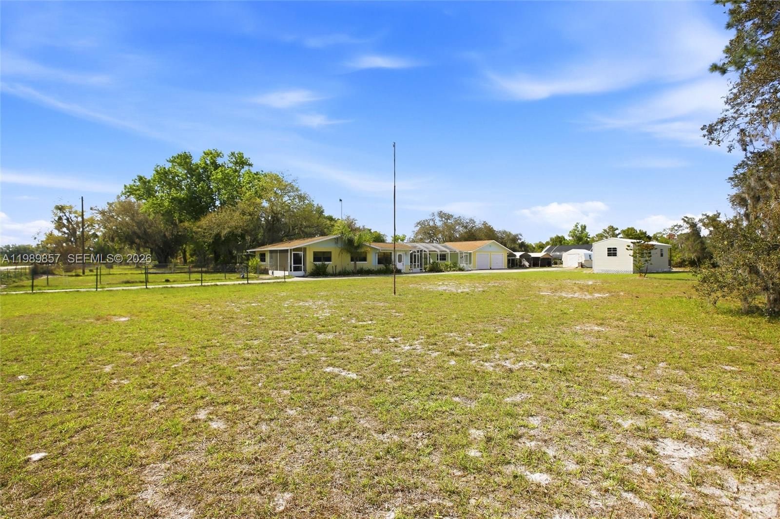 49 Williams Road Lake Placid, FL 33852 - Photo 45 of 61 a view of a swimming pool with an outdoor space and seating area