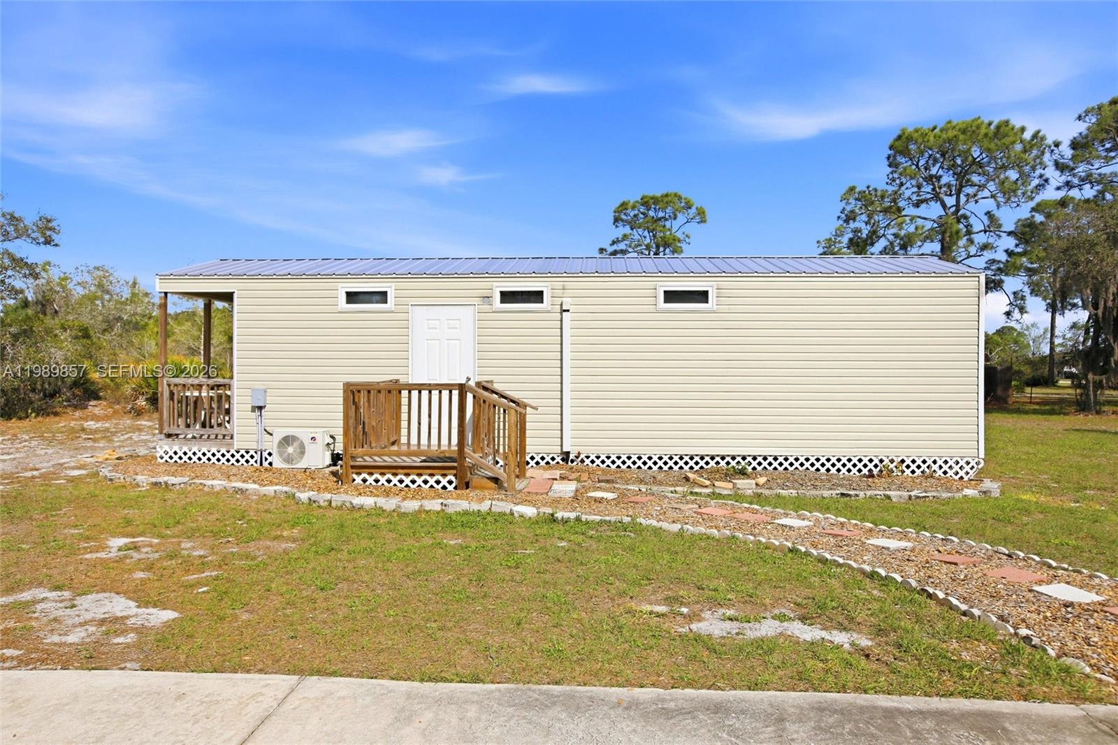 49 Williams Road Lake Placid, FL 33852 - Photo 48 of 61 a front view of a house with a yard