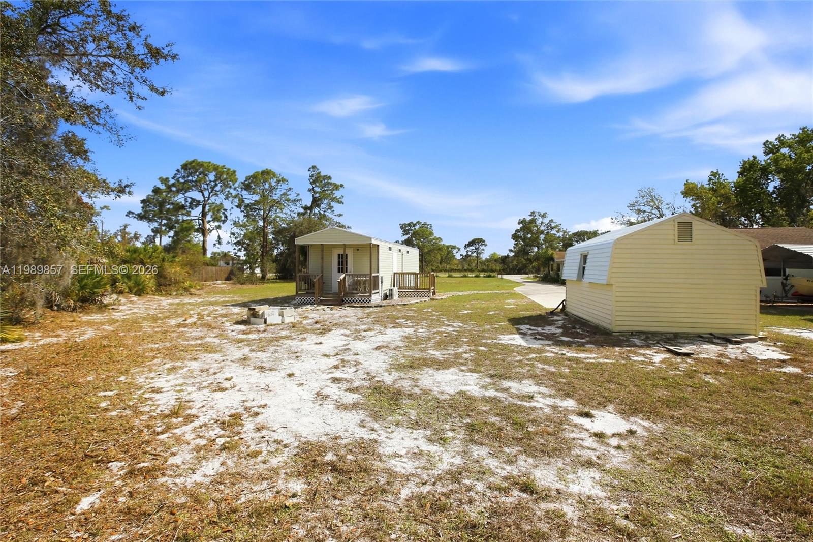 49 Williams Road Lake Placid, FL 33852 - Photo 51 of 61 a view of a yard with a house