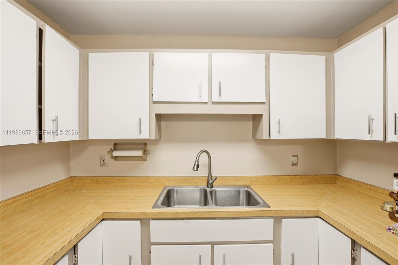 49 Williams Road Lake Placid, FL 33852 - Photo 8 of 61 a kitchen with a sink and cabinets