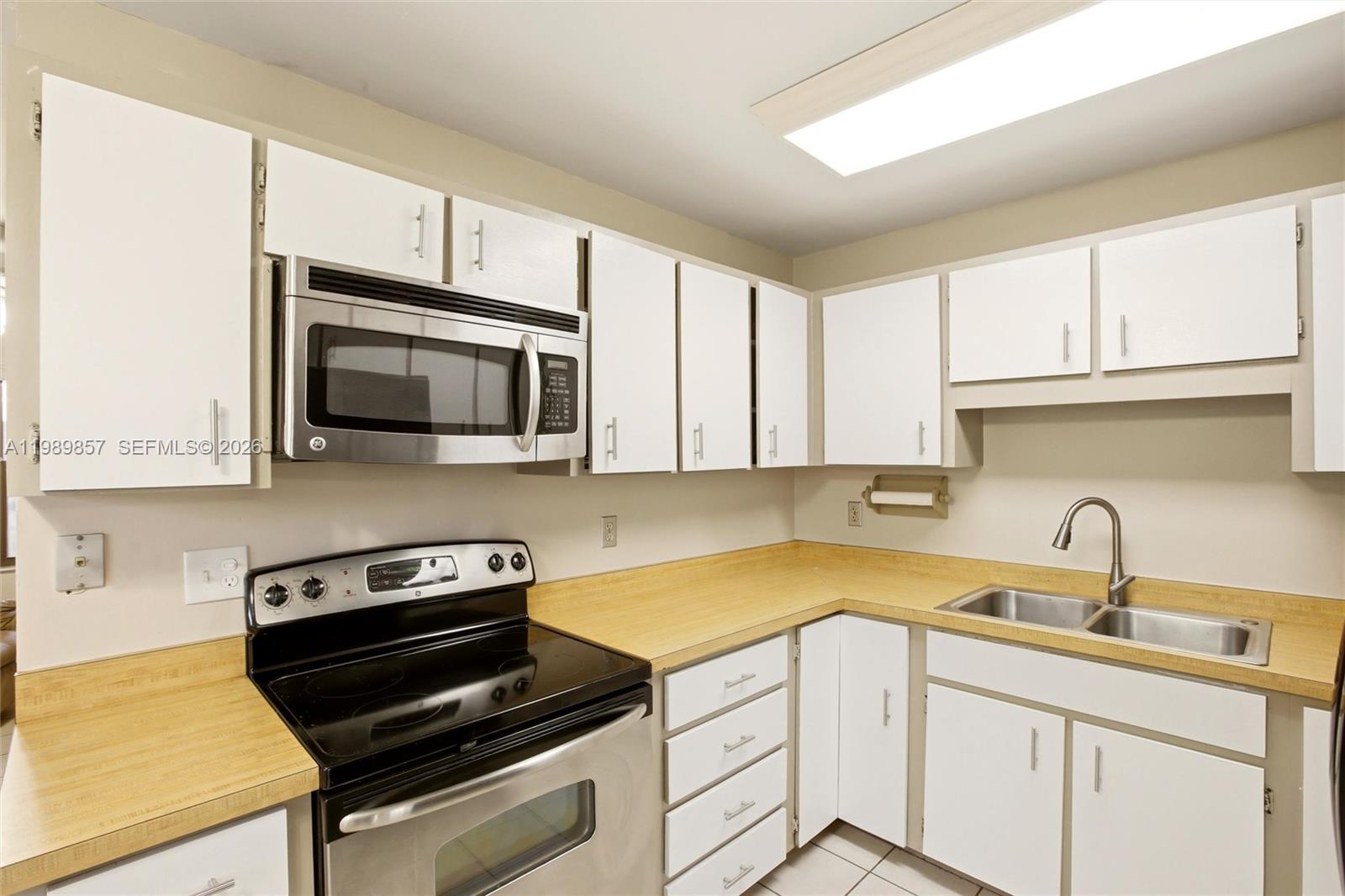 49 Williams Road Lake Placid, FL 33852 - Photo 9 of 61 a kitchen with a sink and cabinets