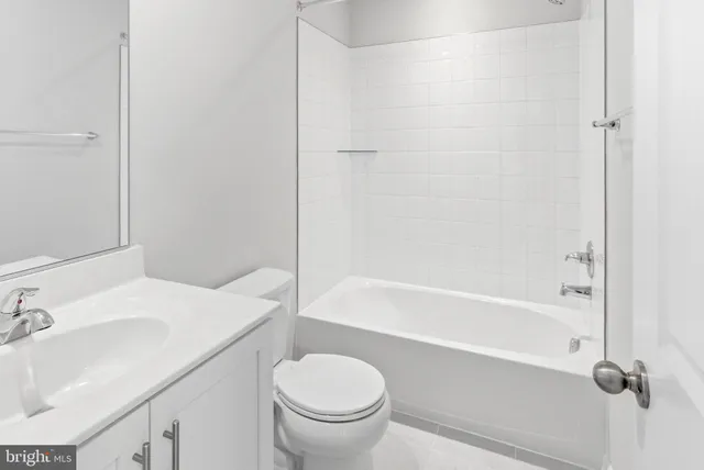 a bathroom with a sink toilet and a bathtub