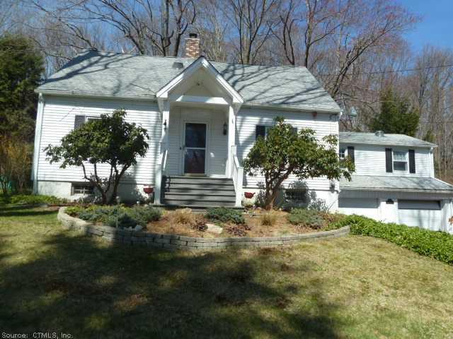 1150 Middlebury Road Watertown, CT 06795 - Photo 1 of 1 a front view of a house with garden