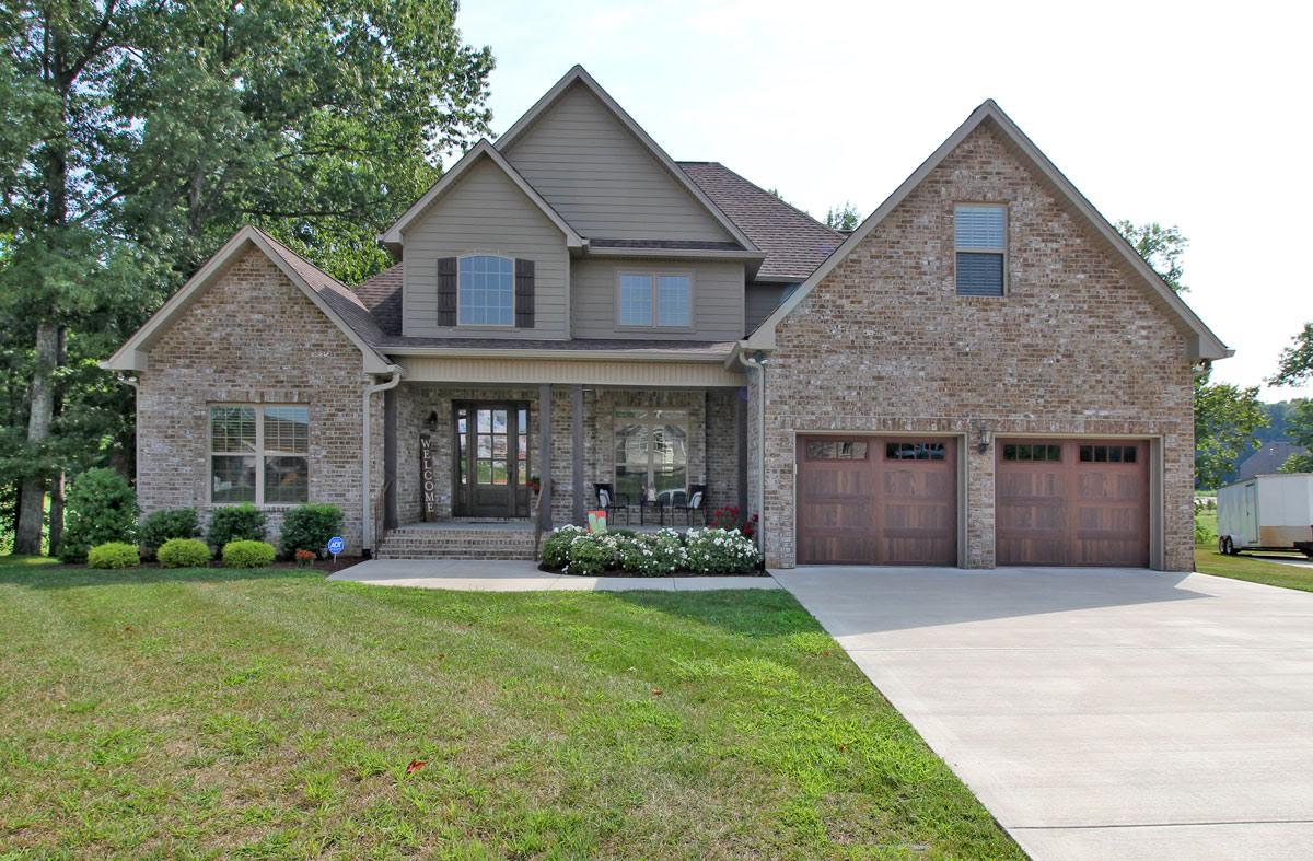 321 Cayce Drive Springfield, TN 37172 - Photo 1 of 30 a front view of a house with a yard and garage