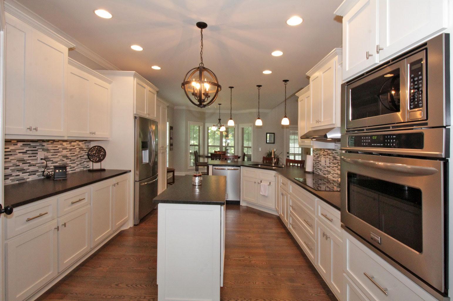 321 Cayce Drive Springfield, TN 37172 - Photo 5 of 30 a large kitchen with stainless steel appliances kitchen island granite countertop a stove a sink and a microwave