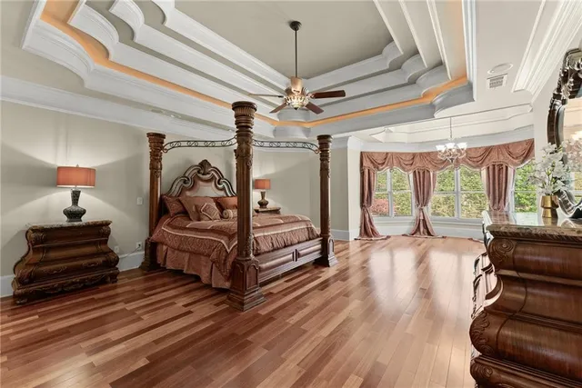 a bathroom with a granite countertop sink toilet mirror and shower