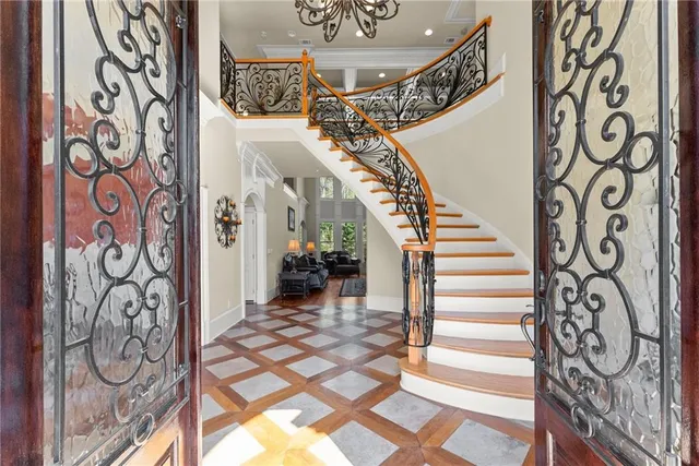 a view of entryway with stairs and wooden floor