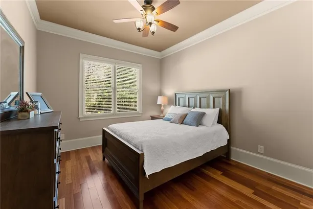 a view of a patio with couches table and chairs and potted plants