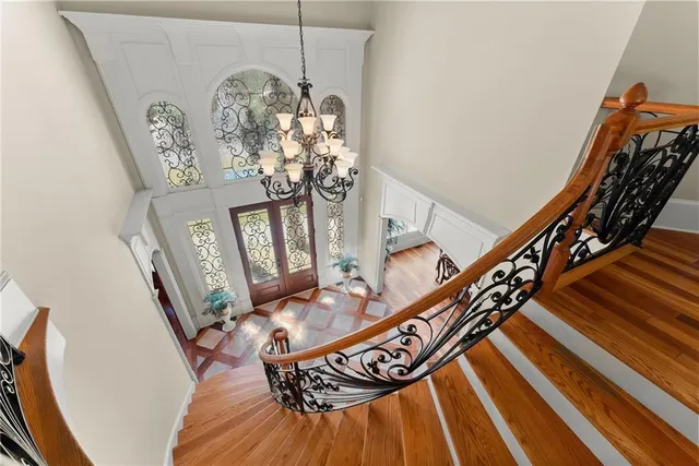 a view of a dining room with furniture and chandelier