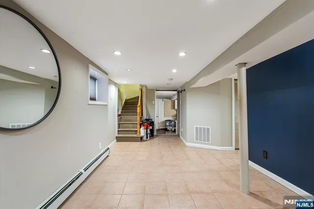a view of a livingroom with furniture and a window
