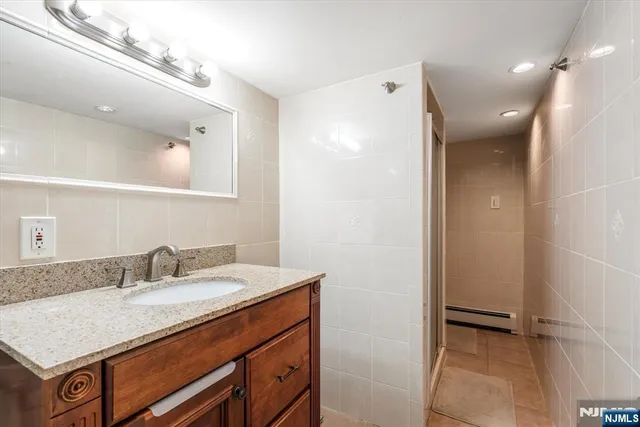 a bathroom with a sink a vanity and a mirror