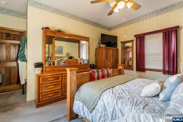 a bedroom with a bed and dresser