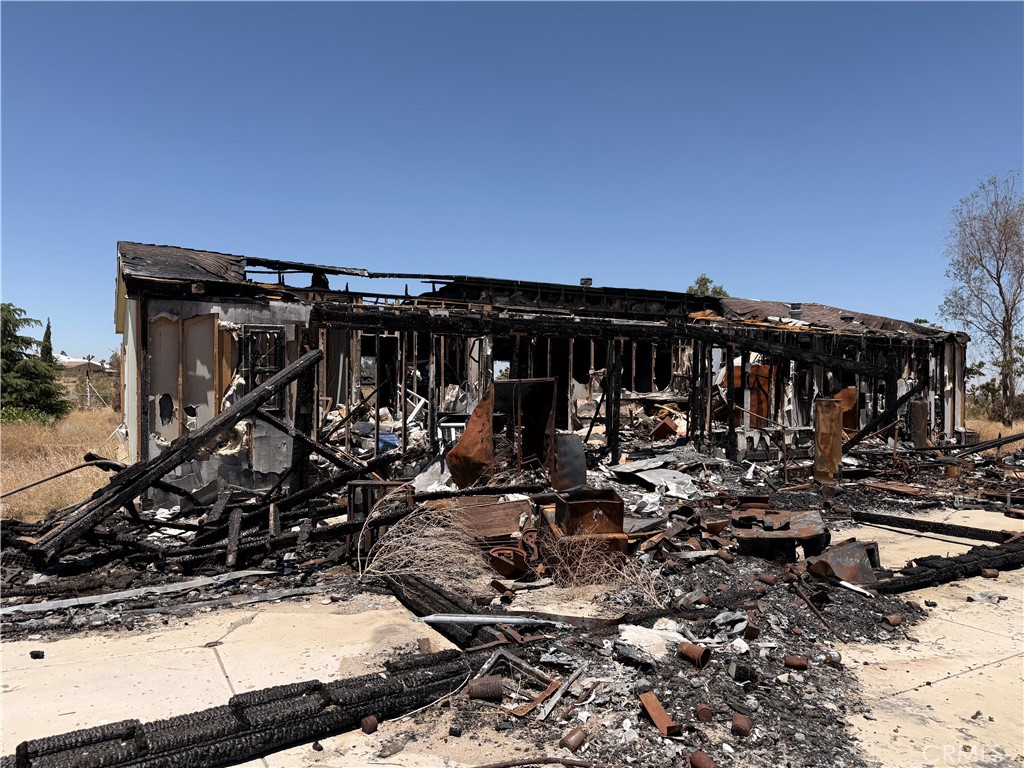 12225 Lager Road Phelan, CA 92371 - Photo 12 of 18 Wide view of fire destruction and backyard debris