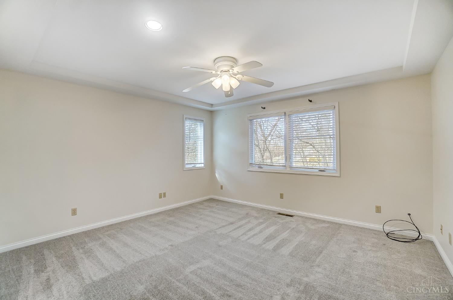5572 Gum Run Road Cleves, OH 45002 - Photo 30 of 91 Spacious primary suite features new carpet and paint, tray ceiling and ceiling fan.
