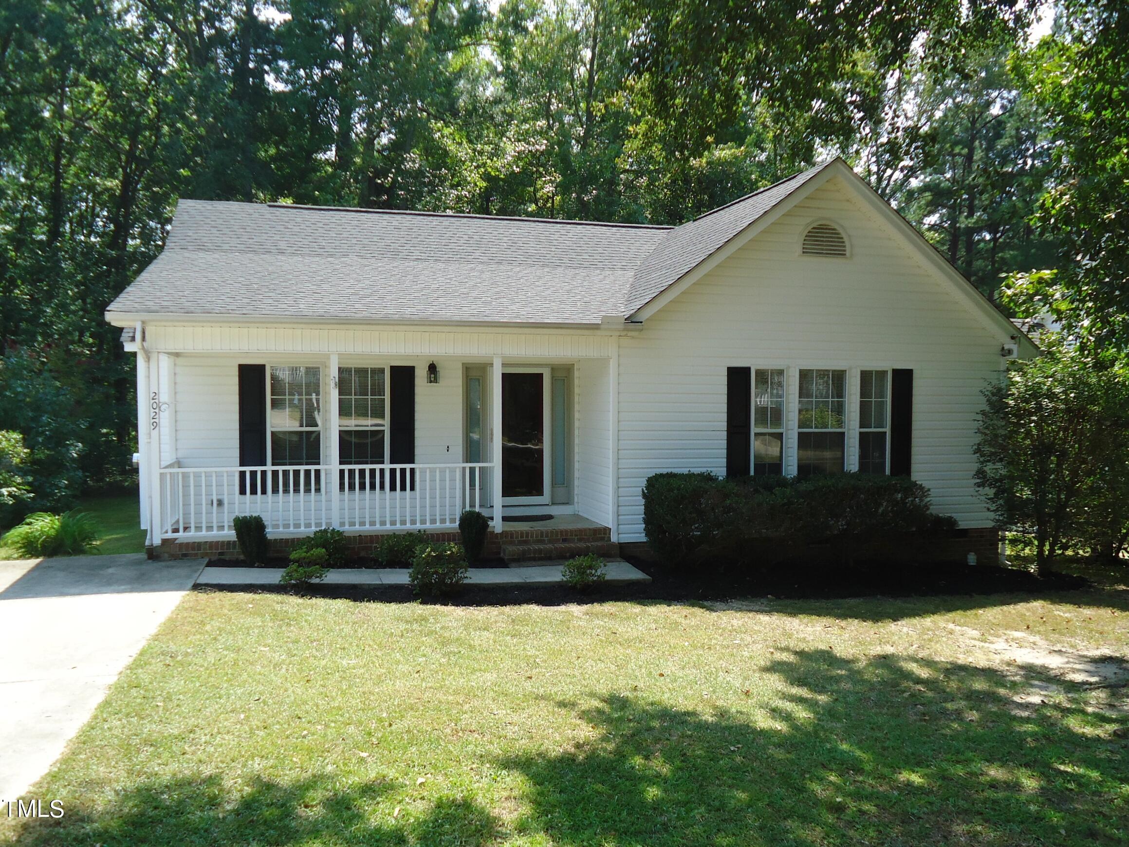 2029 Ruddy Road Raleigh, NC 27616 - Photo 1 of 33 a front view of a house with a yard