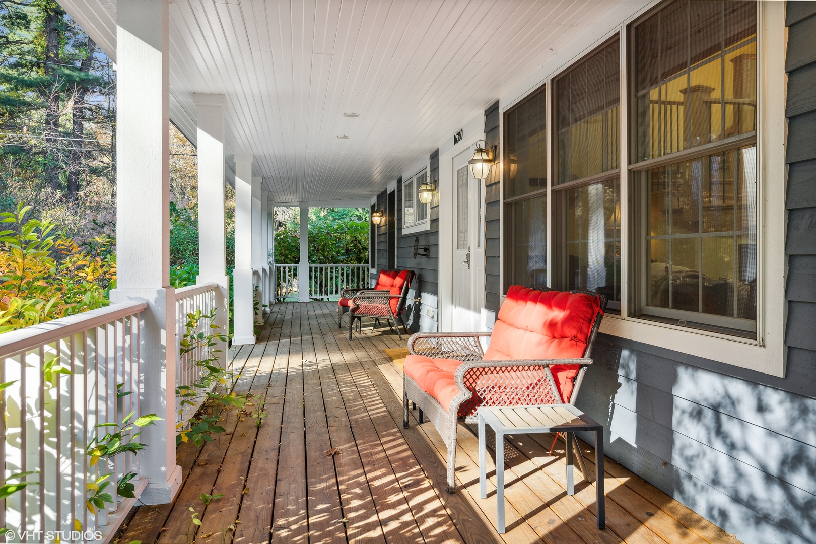 16360 Raz Road Union Pier, MI 49129 - Photo 4 of 54 a balcony with wooden floor and outdoor seating