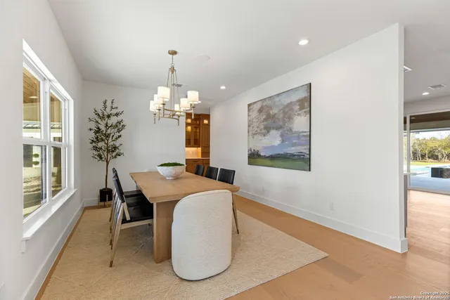 a large kitchen with a large counter top stainless steel appliances and cabinets
