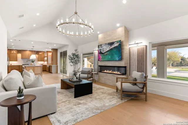 a bathroom with a double vanity sink a mirror and a bathtub
