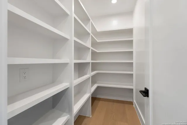 a bathroom with a double vanity sink mirror and shower