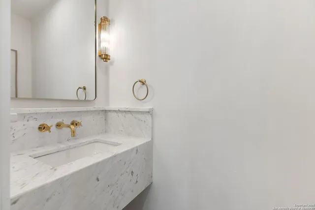 a white bath tub sitting next to a shower