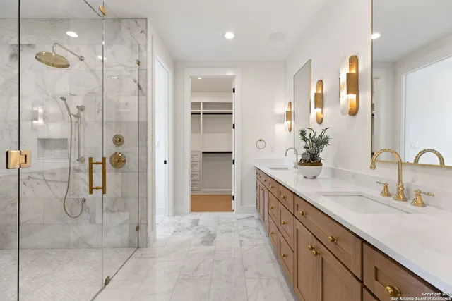 a bathroom with a sink toilet and shower
