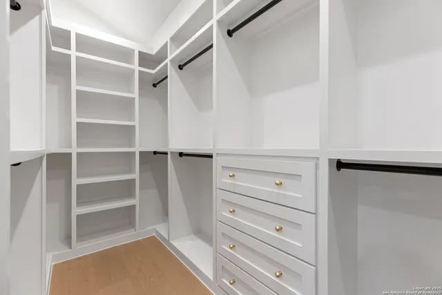 a bathroom with a toilet sink shower and mirror