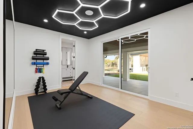 a living room with furniture and kitchen view