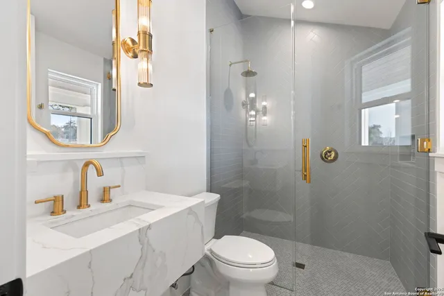 a kitchen with stainless steel appliances granite countertop a sink refrigerator and cabinets