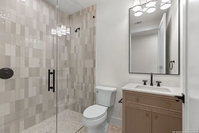 a kitchen with a sink appliances and a living room view