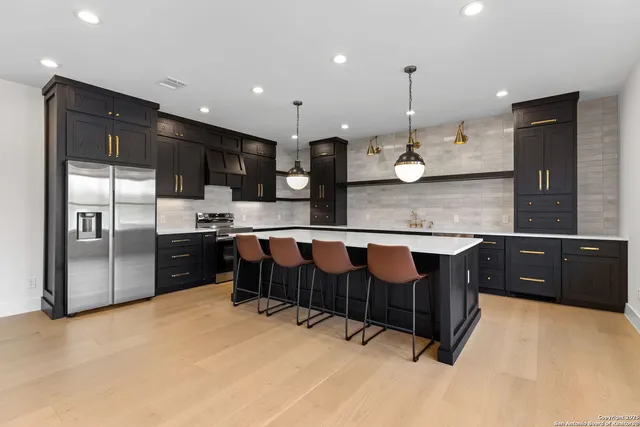 a view of a patio with a table and chairs