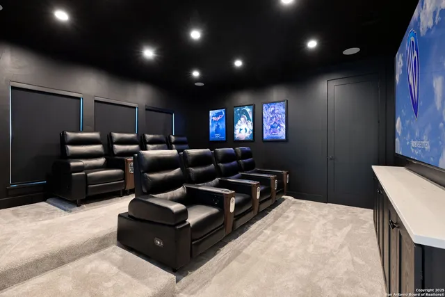 a view of a swimming pool with lounge chairs in patio