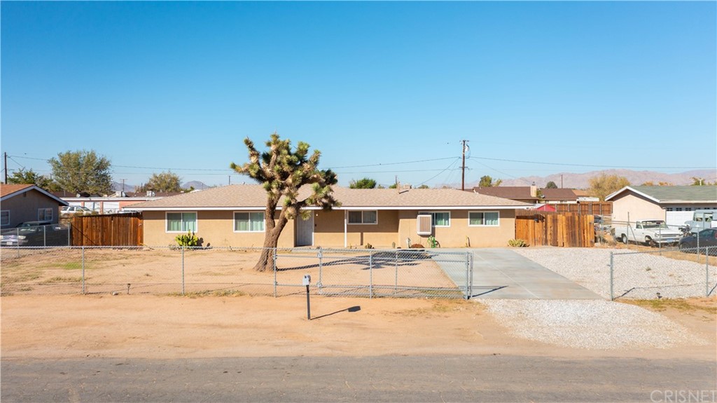 22144 Kayenta Road Apple Valley, CA 92308 - Photo 1 of 1 front view of a house with a street