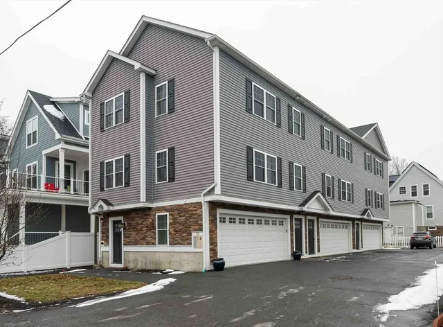 a front view of a building with a road