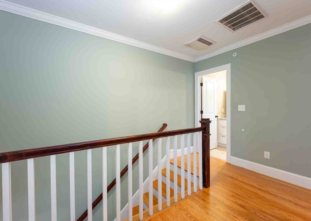51 Branch Street, Unit 2 Quincy, MA 02169 - Photo 20 of 37 a view of staircase with railing and a rug