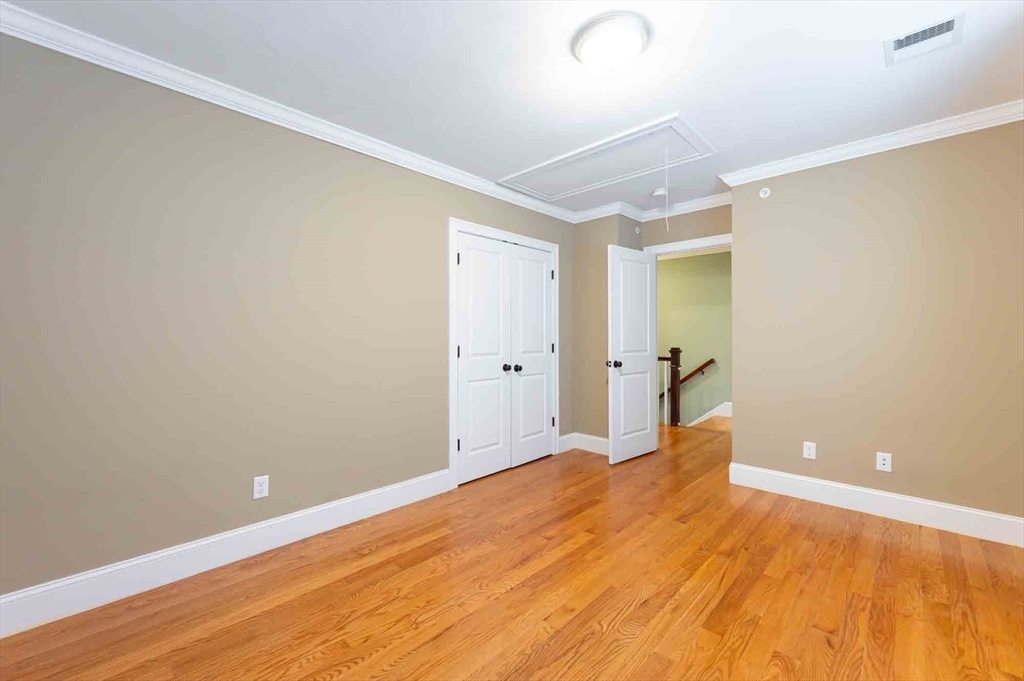 51 Branch Street, Unit 2 Quincy, MA 02169 - Photo 27 of 37 a view of a big room with wooden floor and windows