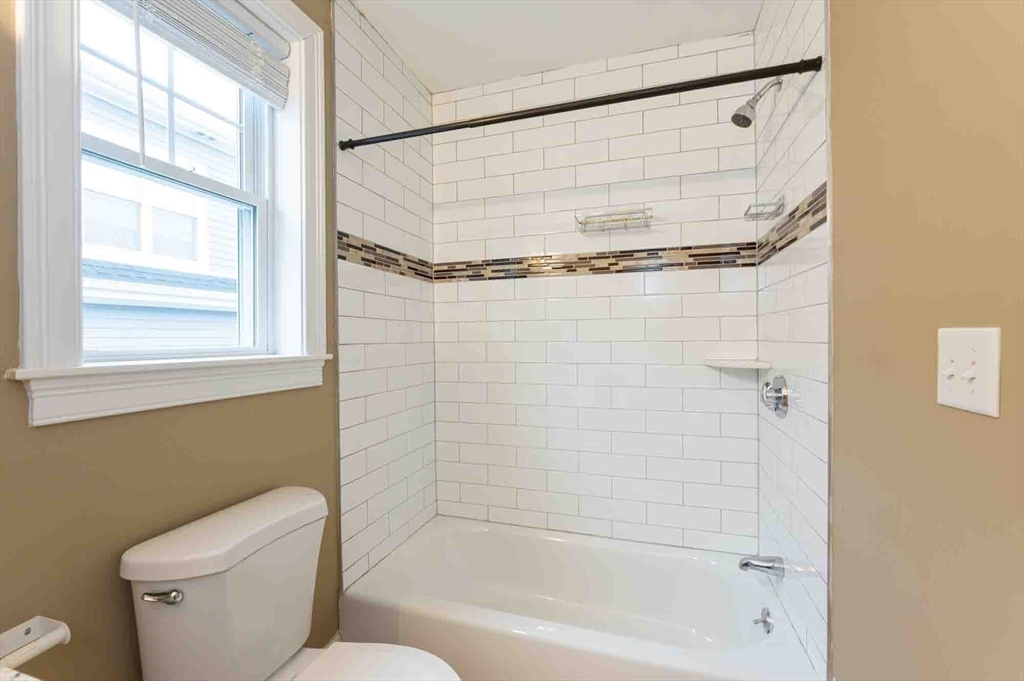 51 Branch Street, Unit 2 Quincy, MA 02169 - Photo 32 of 37 a bathroom with a toilet and a shower