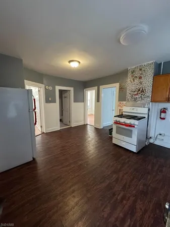 a view of a livingroom with furniture and wooden floor