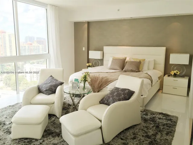 a bed room with a bed and a couch