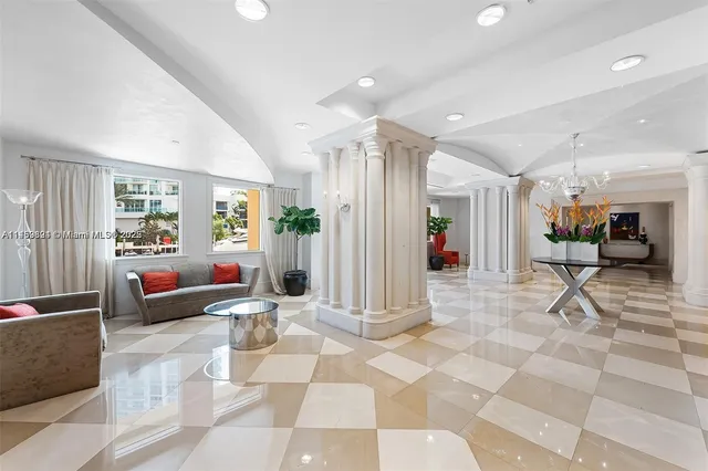a living room with furniture and a rug