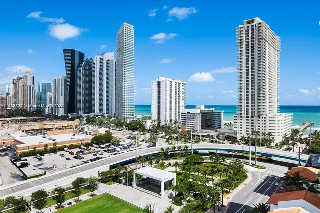 a view of a pathway of house with flower garden