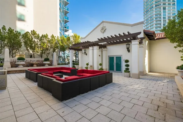 a view of a livingroom with furniture and a potted plant