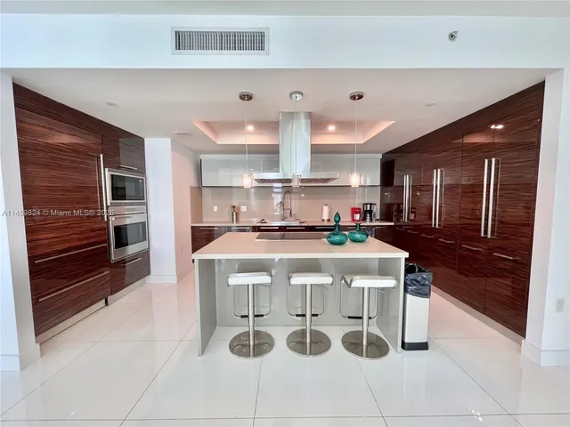 a kitchen with a stove and a refrigerator