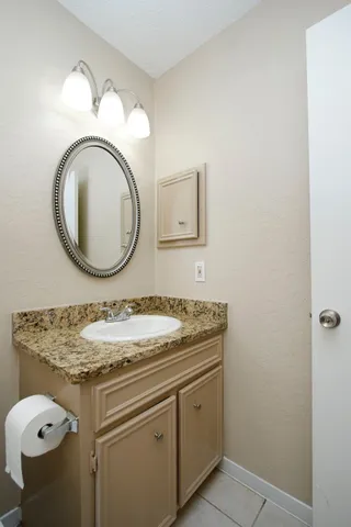 an empty room with fan and windows