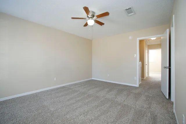 a view of a door and wooden fence