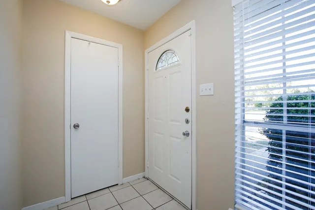a view of empty room with windows