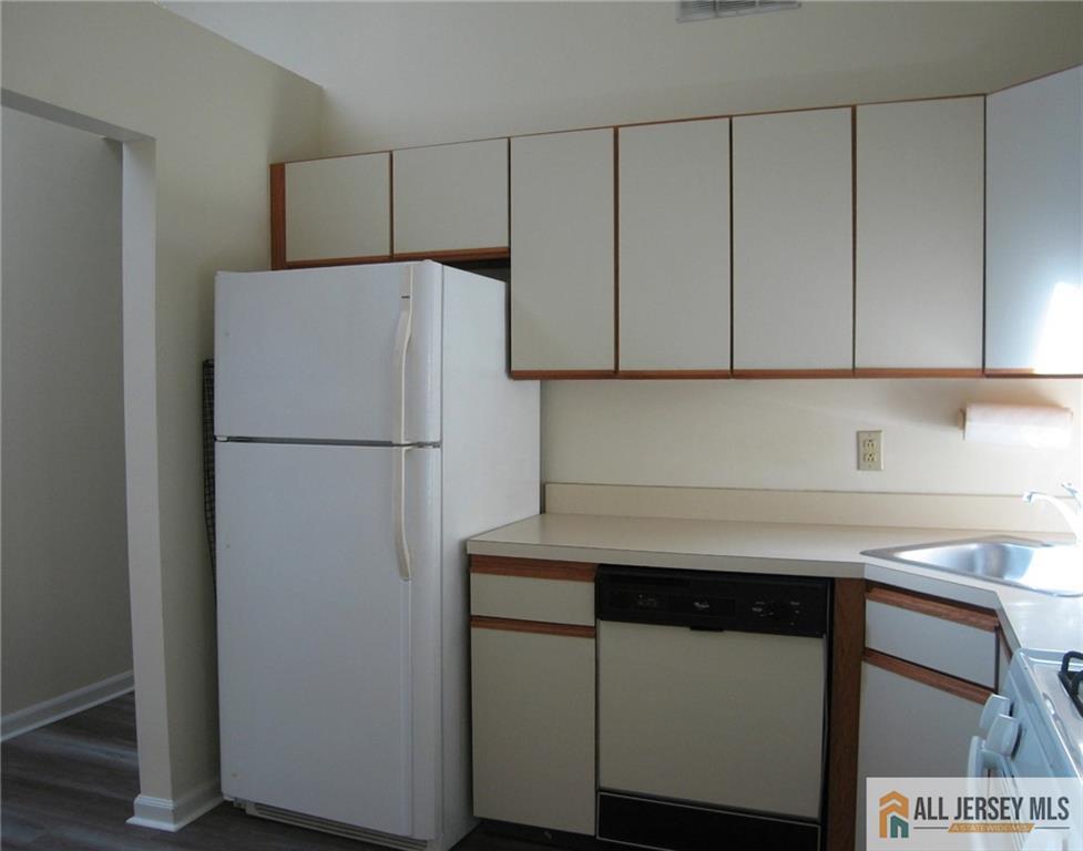 152 Darwin Lane North Brunswick, NJ 08902 - Photo 2 of 14 a kitchen with a sink and a refrigerator