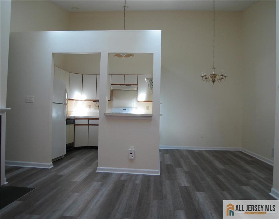 152 Darwin Lane North Brunswick, NJ 08902 - Photo 4 of 14 a view of a room with wooden floor and electronic appliances