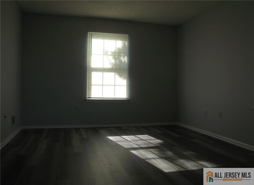 152 Darwin Lane North Brunswick, NJ 08902 - Photo 10 of 14 a view of wooden floor and windows in a room