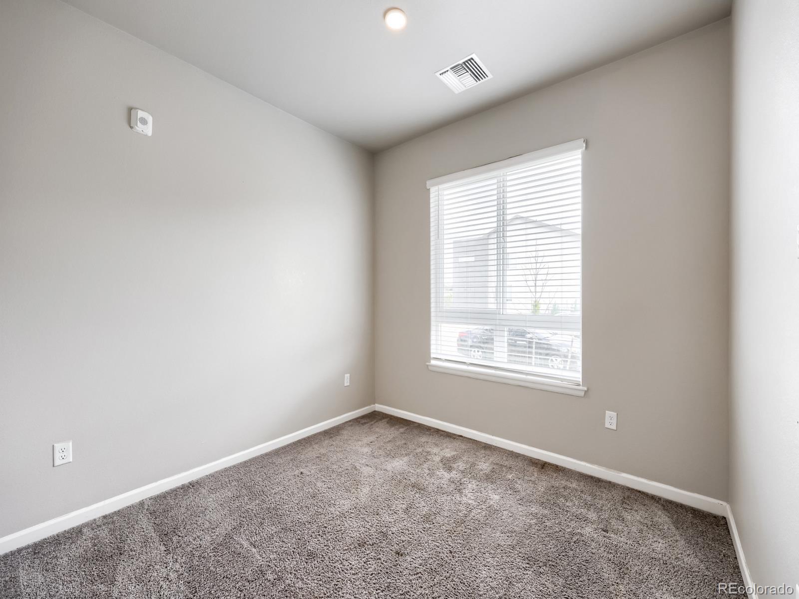 6153 North Ceylon Street, Unit 10108 Denver, CO 80249 - Photo 11 of 11 an empty room with a window